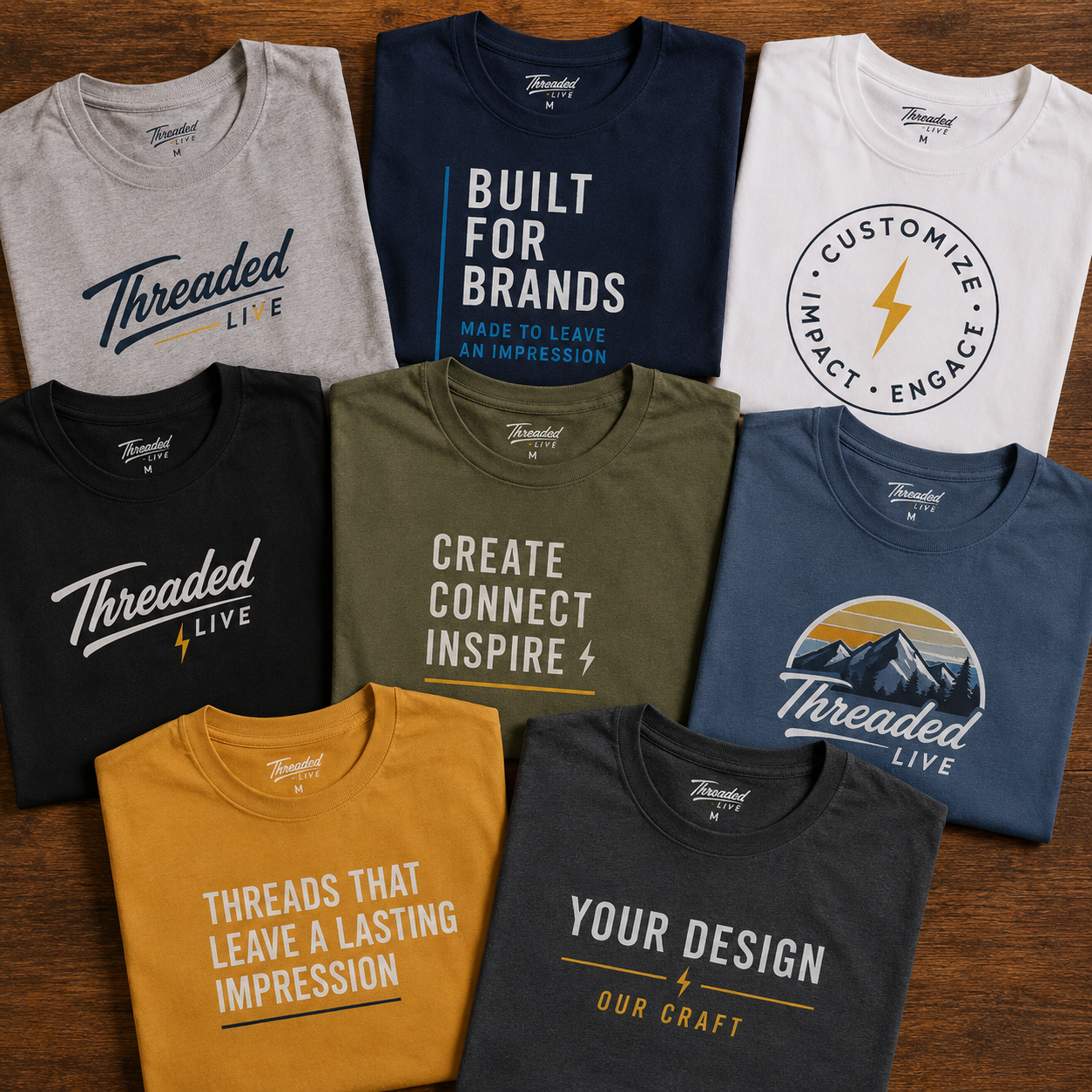 Folded custom Threaded Live t-shirts in nine colors with printed brand designs